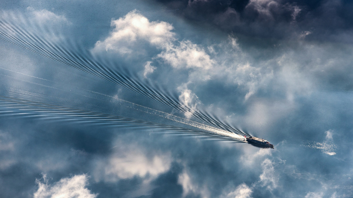 A steamboat in the middle of a sea of clouds.